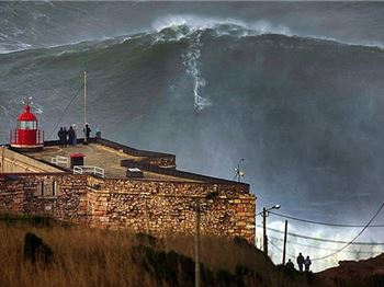 Surfers ride 140ft waves in Portugal - Surfing News