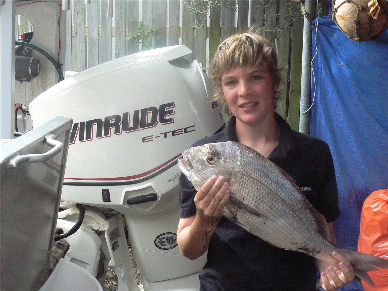 Luke with his first snapper...