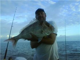 my brother and i with 2 moretonbay snapper