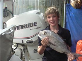 Luke with his first snapper...