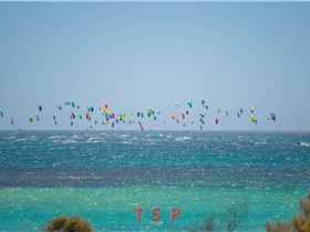 Kitesurfers heading out to 1st turn marker