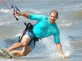 Shot of Chris Rose who owns the kite shop here