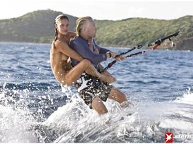 Richard Branson with naked model on his back