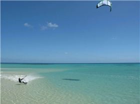 Flat clear water and miles of it right in the wind belt off Port Douglas