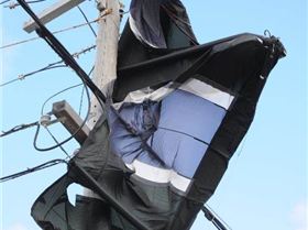 Kite up a power pole