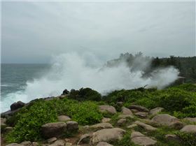 Swell breaking over hotel