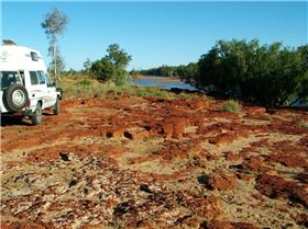 Camp by a rocky pool