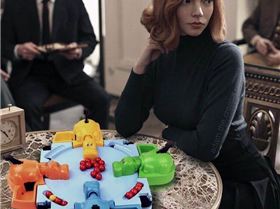 Beth Harmon gambits the orange hippo