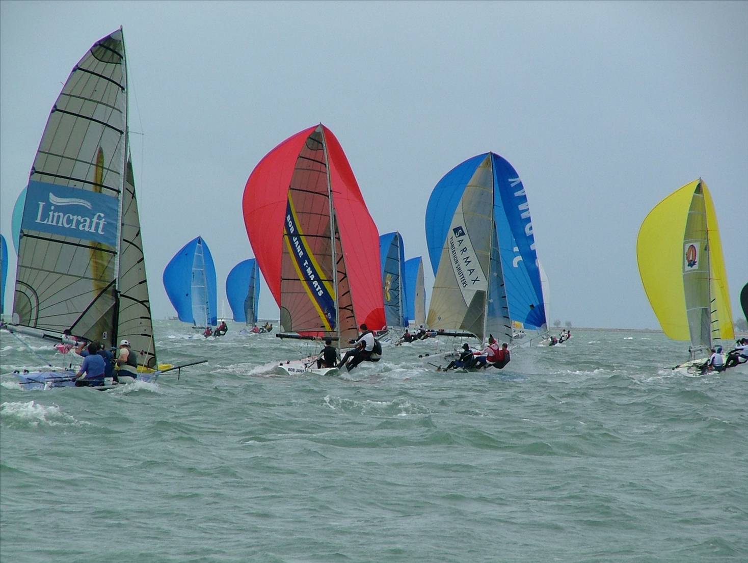 Around the top mark 16 Skiffs at RQYS