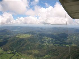 Hang gliding at cloud base