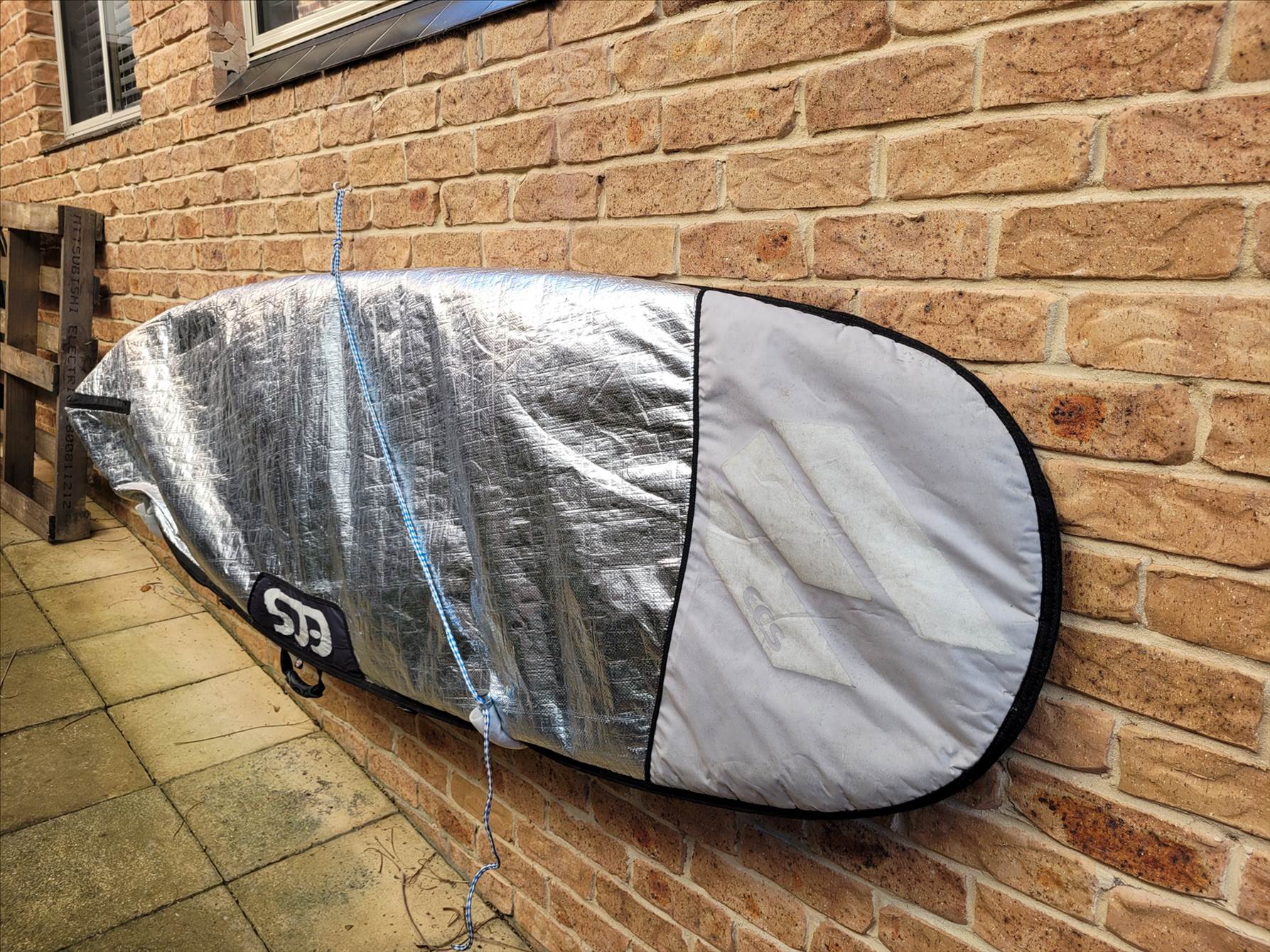 storing board outside on wall brackets