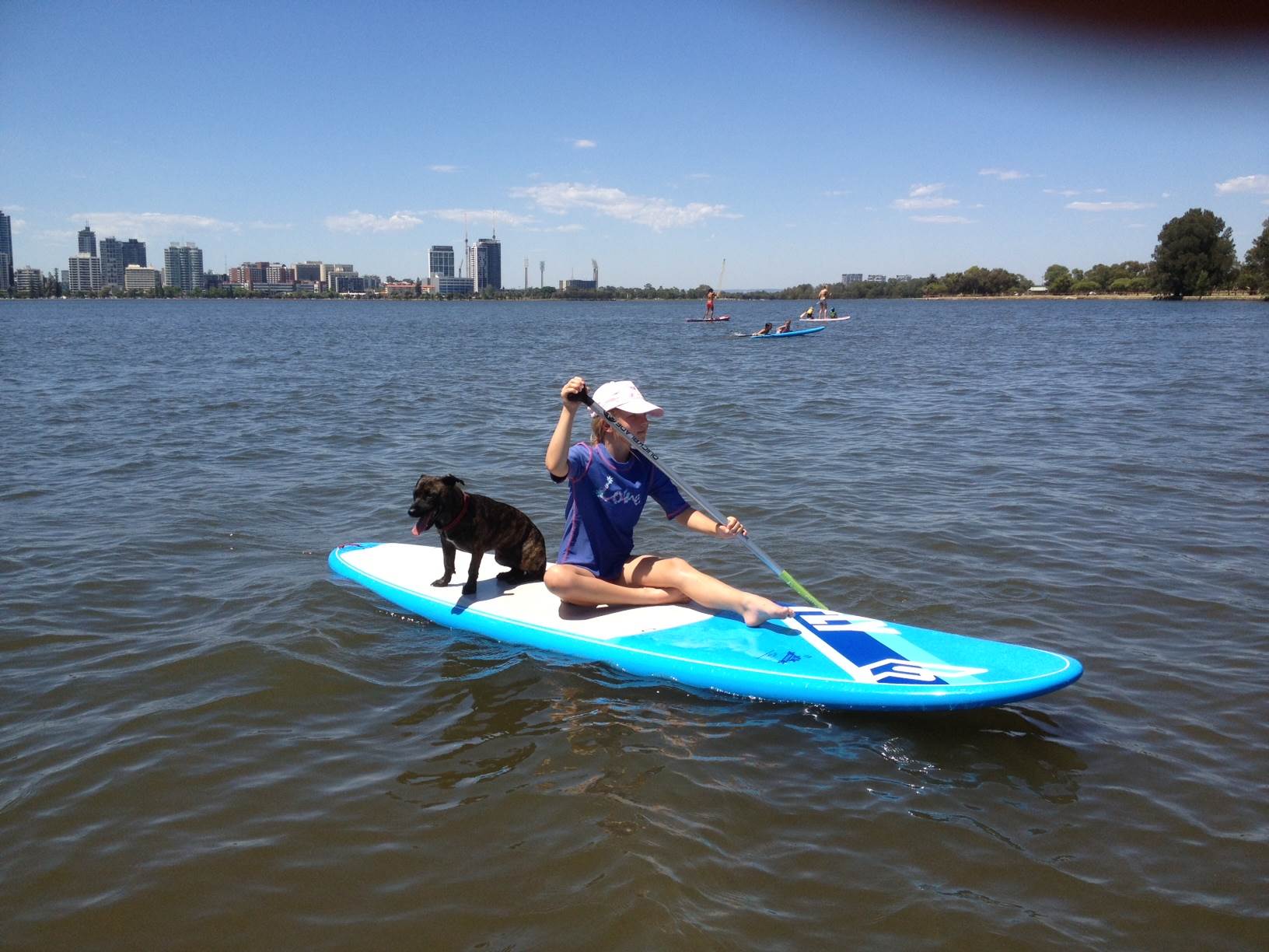 Daughter and dog on a hot day