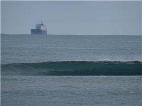 Qld SUP surfing team members in action