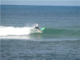 Qld SUP surfing team members in action