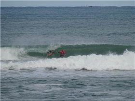 Qld SUP surfing team members in action