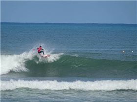 Qld SUP surfing team members in action
