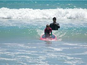 Kids learn to surf