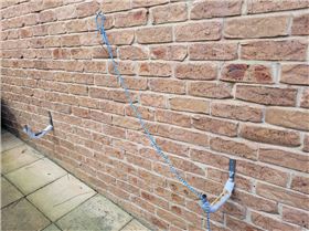 storing board outside on wall brackets