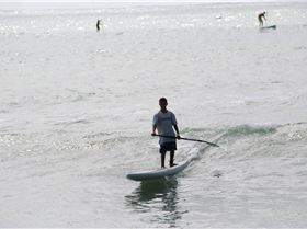 Riggs on his prone paddle board