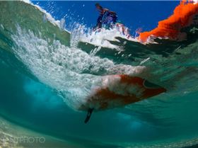 PAUL underneath board wave