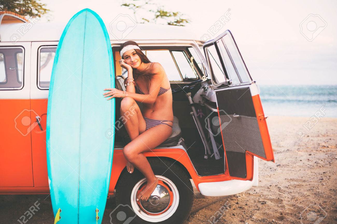 40268338-Beach-Lifestyle-Beautiful-Surfer-Girl-with-Classic-Vintage-Surf-Van-on-the-Beach-at-Sunset-