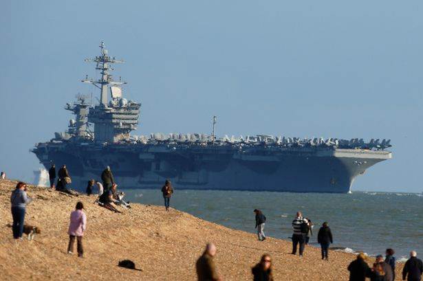 PAY-People-watch-as-aircraft-carrier-USS-Theodore-Roosevelt-arrives-in-the-Solent