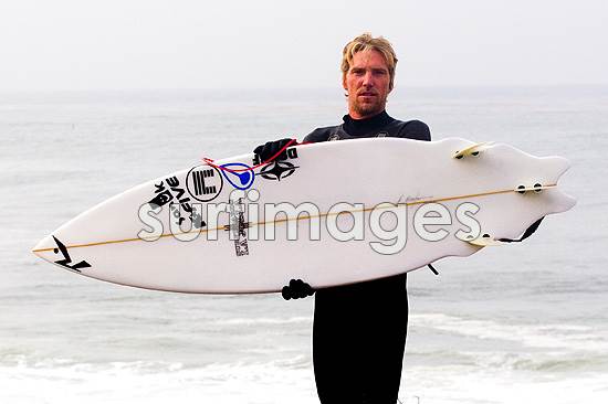 eli-mirandon-holding-surfboard