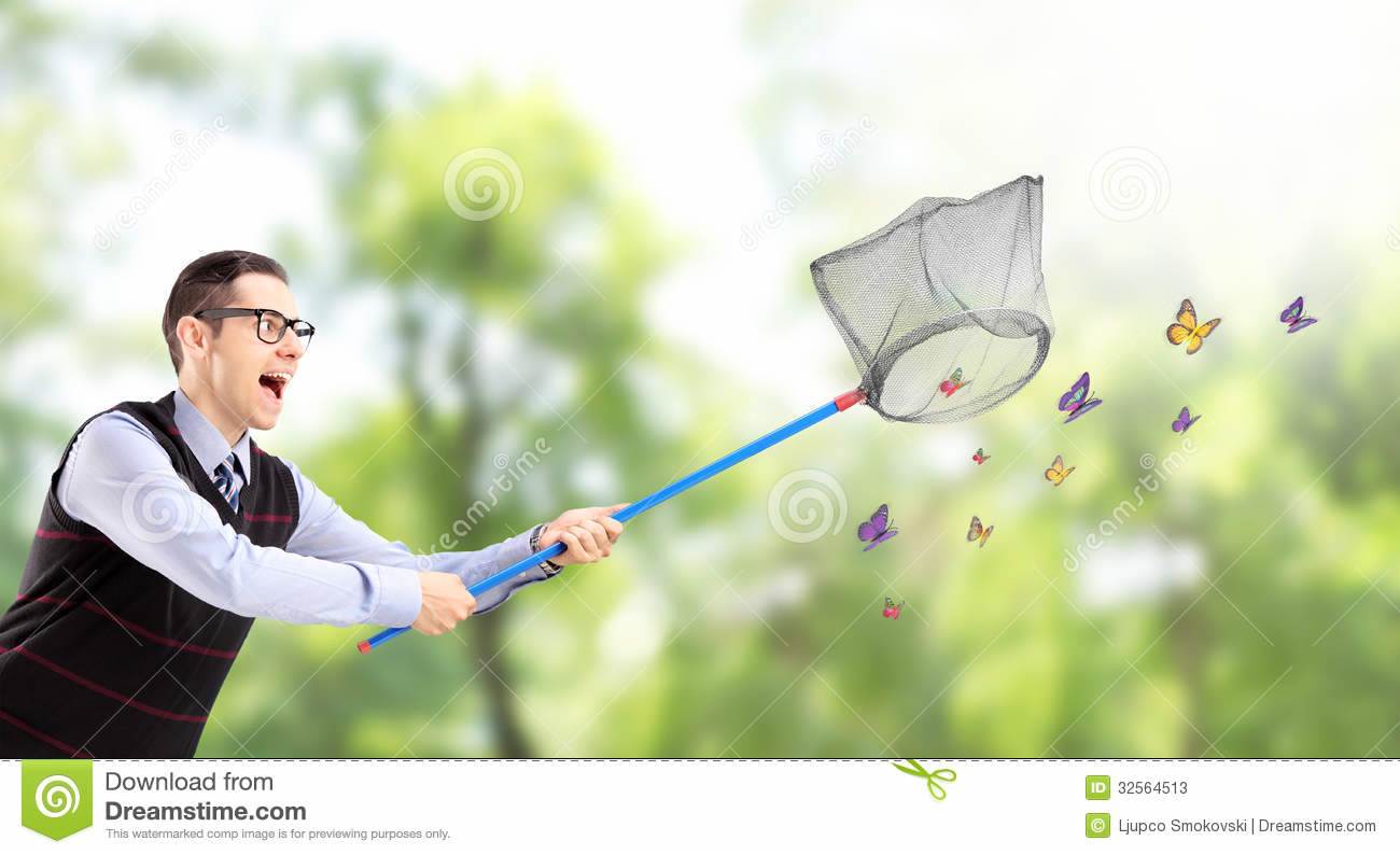 male-catching-butterflies-net-park-young-32564513