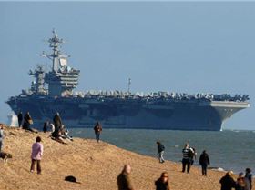 PAY-People-watch-as-aircraft-carrier-USS-Theodore-Roosevelt-arrives-in-the-Solent