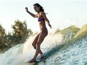 woman-surfing-wave h