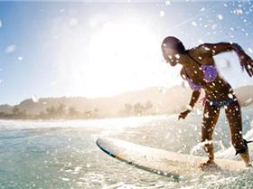 girl-longboarding-surf