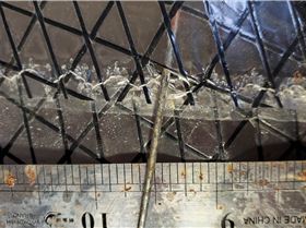 black thread exposed with small tears