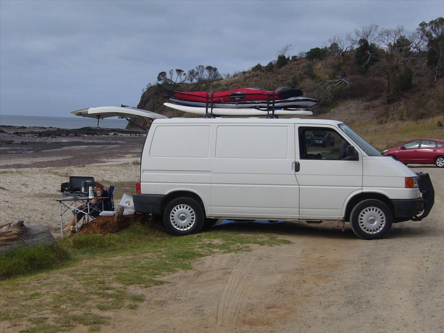 VW Transporter with boards on roof