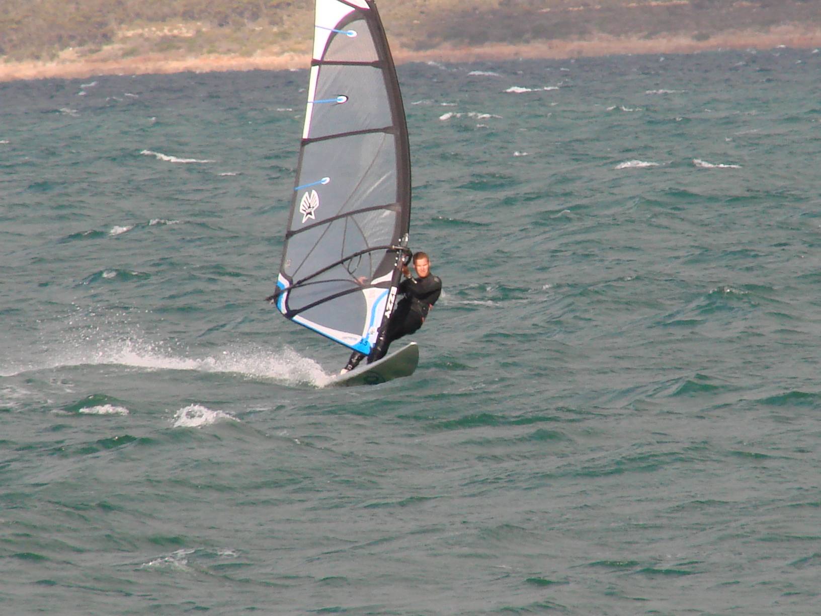 Testing the 2010 95L OES twin fin for speed and turning on flat water next to a single fin