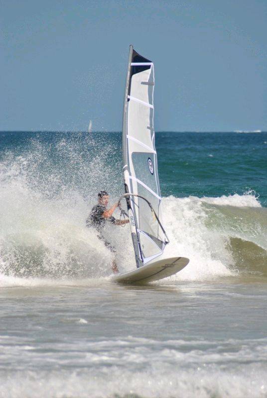 Getting some good waves and getting smashed on my SUP