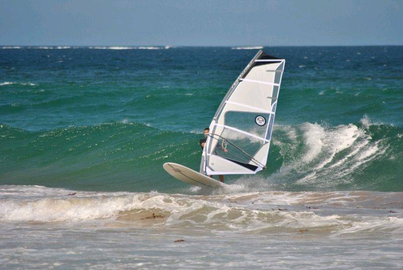 Getting some good waves and getting smashed on my SUP