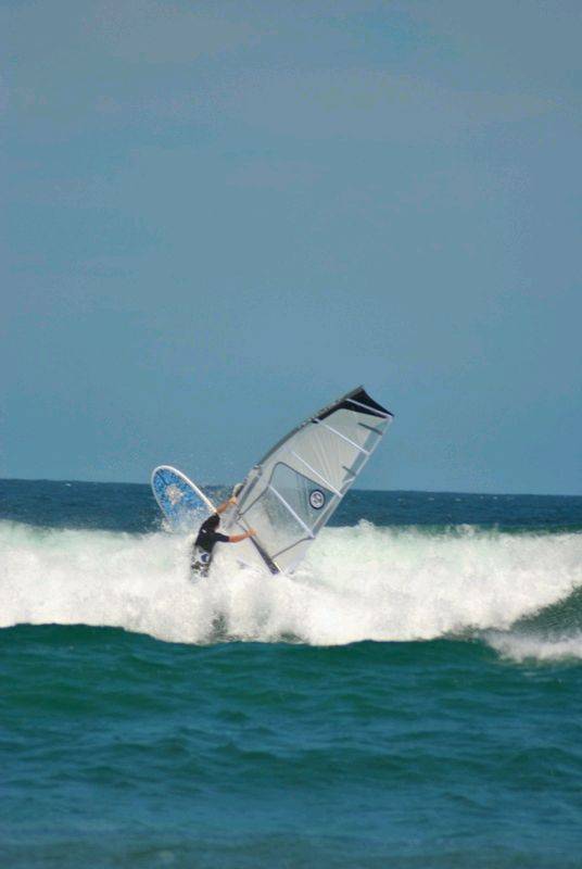 Getting some good waves and getting smashed on my SUP