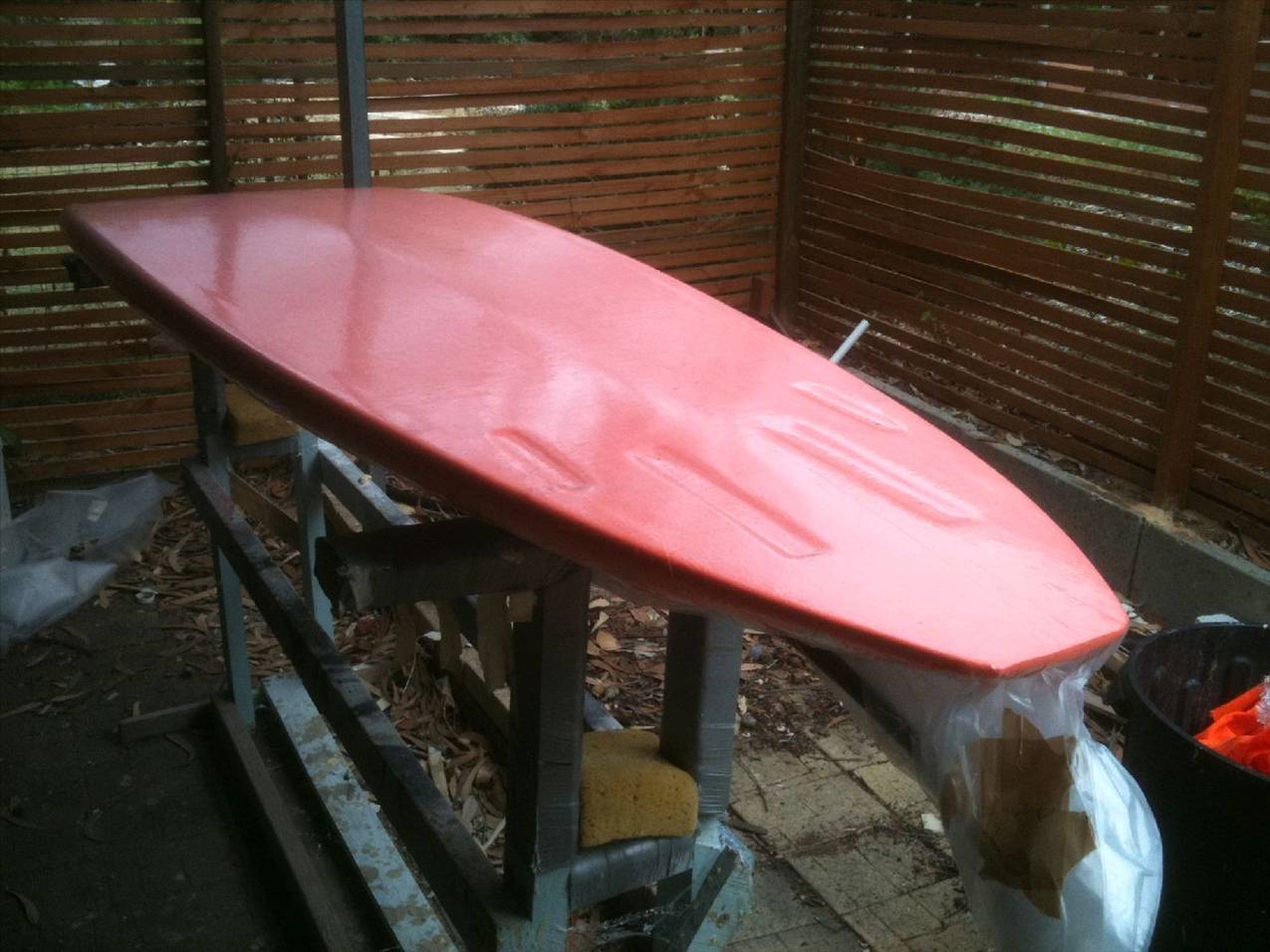 My new board getting the glass sucked on in the vacuum bag, the orange is the bleeder material.