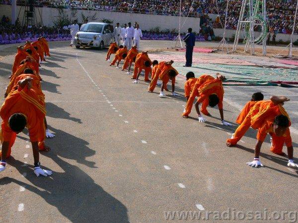 46. Swami's car being welcomed in an unusual way by the Primary School boys when He arrives for the 
