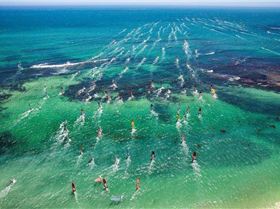 Windsurfers heading out