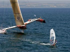 WindsurferKicksAssOfTrimaran