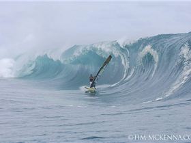 Tackling Teahupoo on a windsurfer