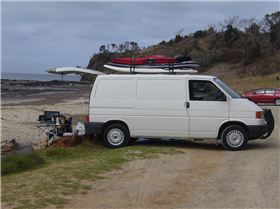 VW Transporter with boards on roof
