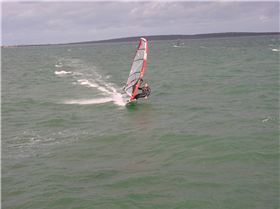 Testing the 2010 95L OES twin fin for speed and turning on flat water next to a single fin