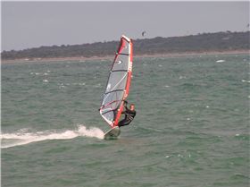 Testing the 2010 95L OES twin fin for speed and turning on flat water next to a single fin