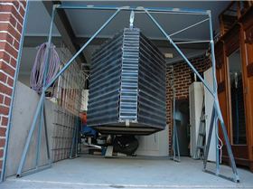 Windsurfing Trailer Box, suspended by lifting frames while trailer is on other duties