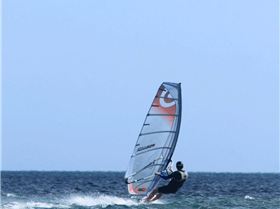 The coral reef is the lighter coloured part on the bottom right