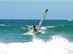 Getting some good waves and getting smashed on my SUP