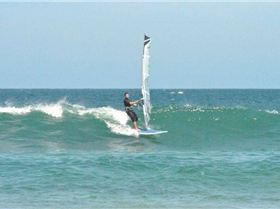 Getting some good waves and getting smashed on my SUP