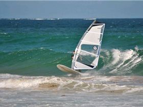 Getting some good waves and getting smashed on my SUP